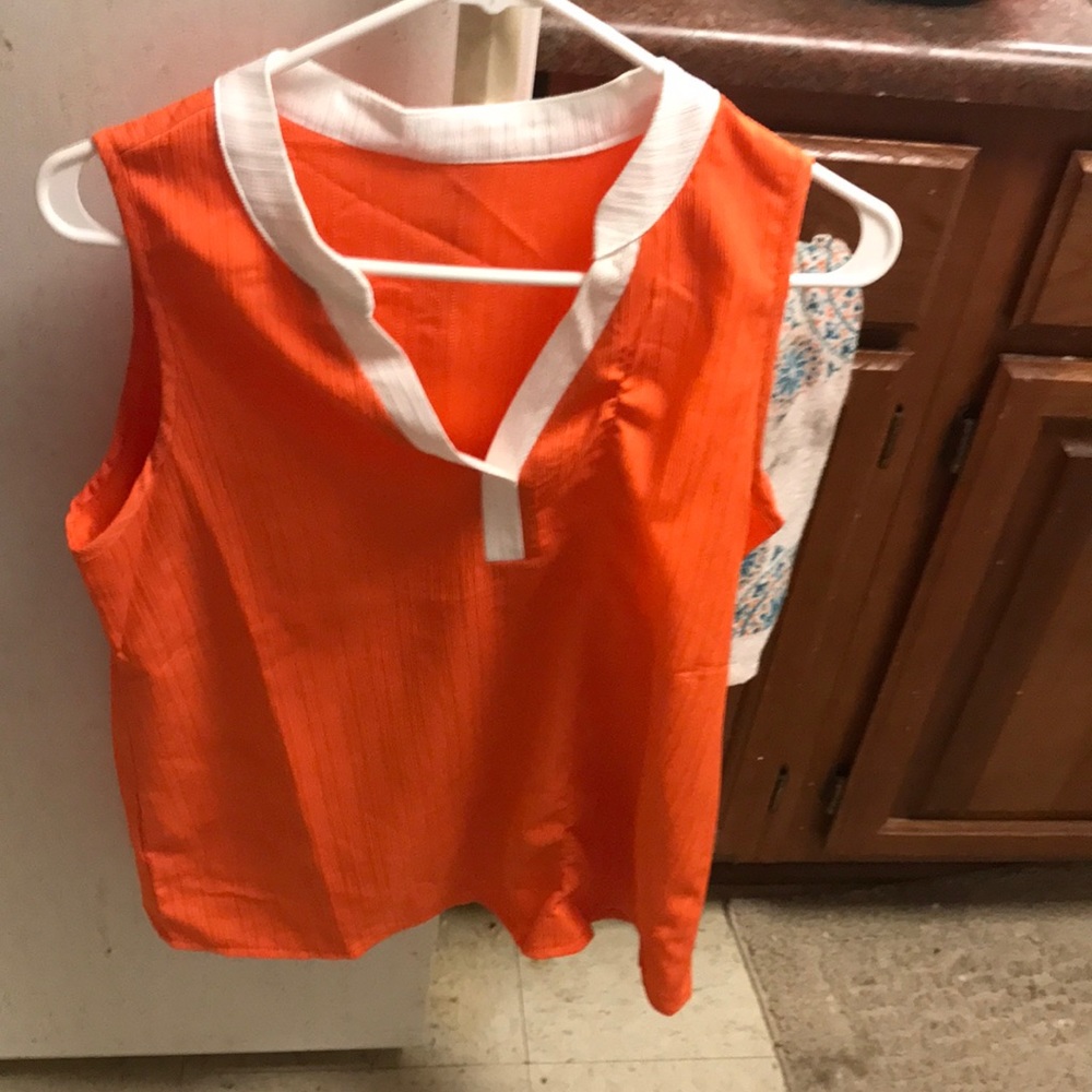 Orange tank top with white trim around neck